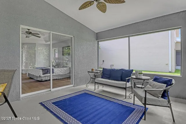 a living room with furniture and a rug