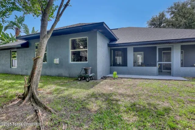 a backyard of a house with seating space