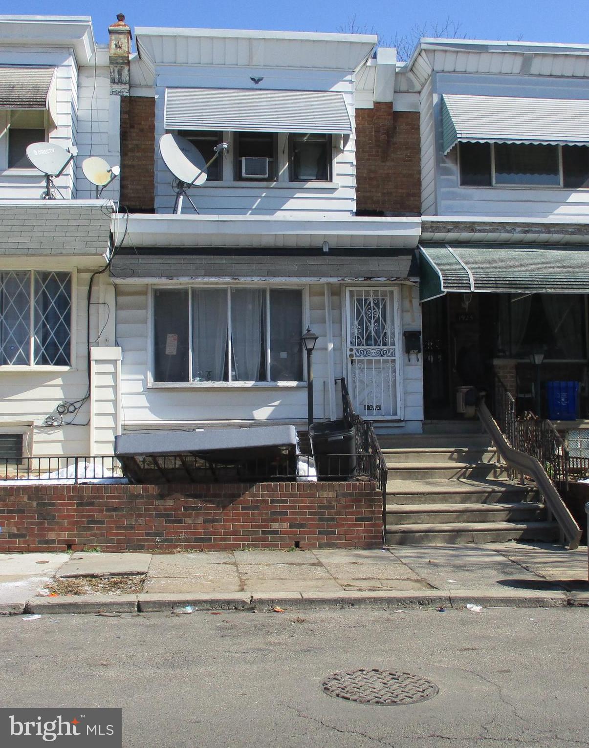 1923 Pratt Street Philadelphia, PA 19124 - Photo 1 of 1 a front view of a house with a floor to ceiling windows