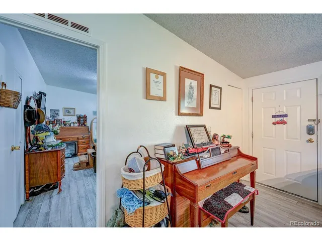 a room with furniture and wooden floor