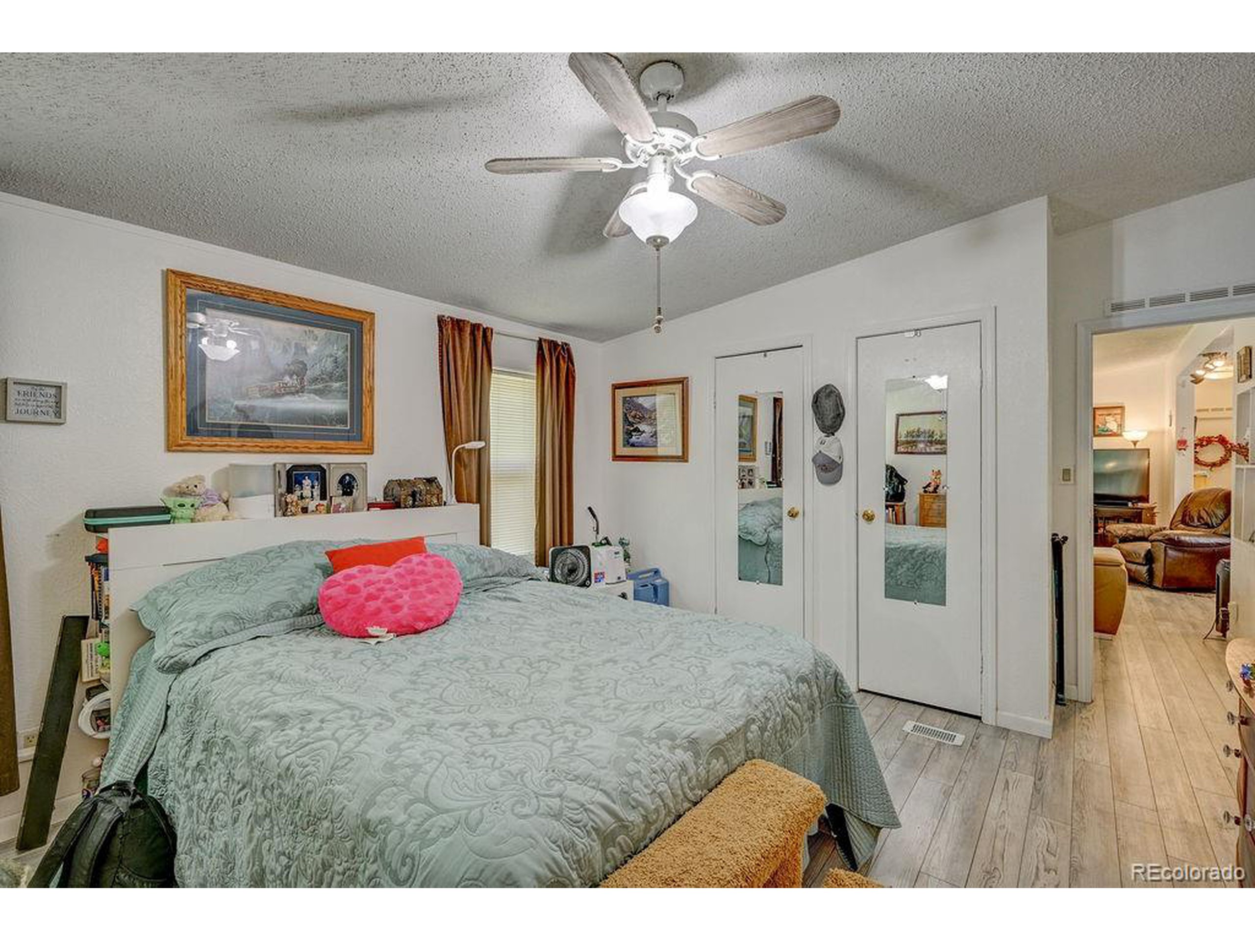 121 Brookdale Avenue Buena Vista, CO 81211 - Photo 15 of 50 a bed room with a bed and a chandelier