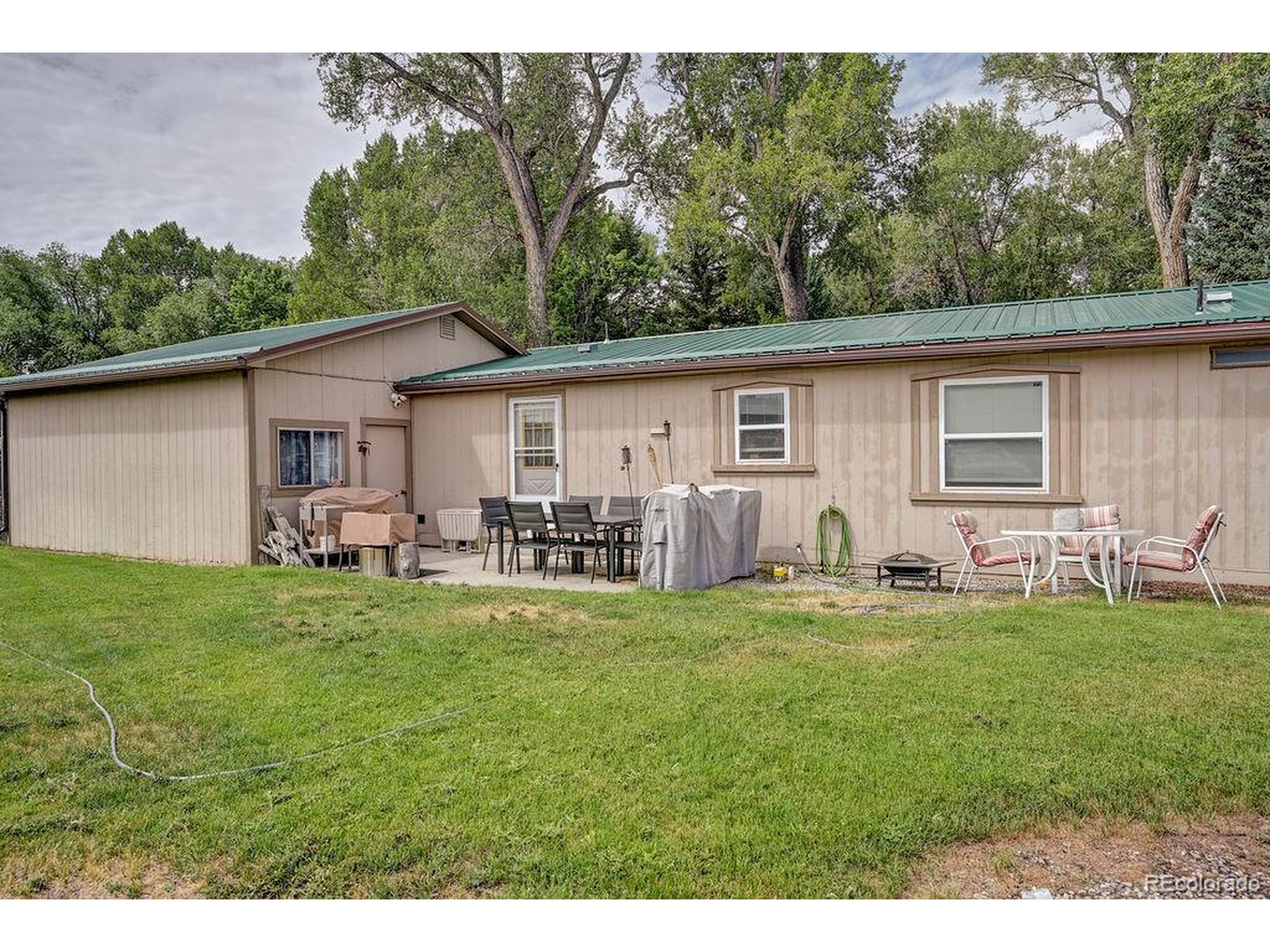 121 Brookdale Avenue Buena Vista, CO 81211 - Photo 17 of 50 a backyard of a house with table and chairs