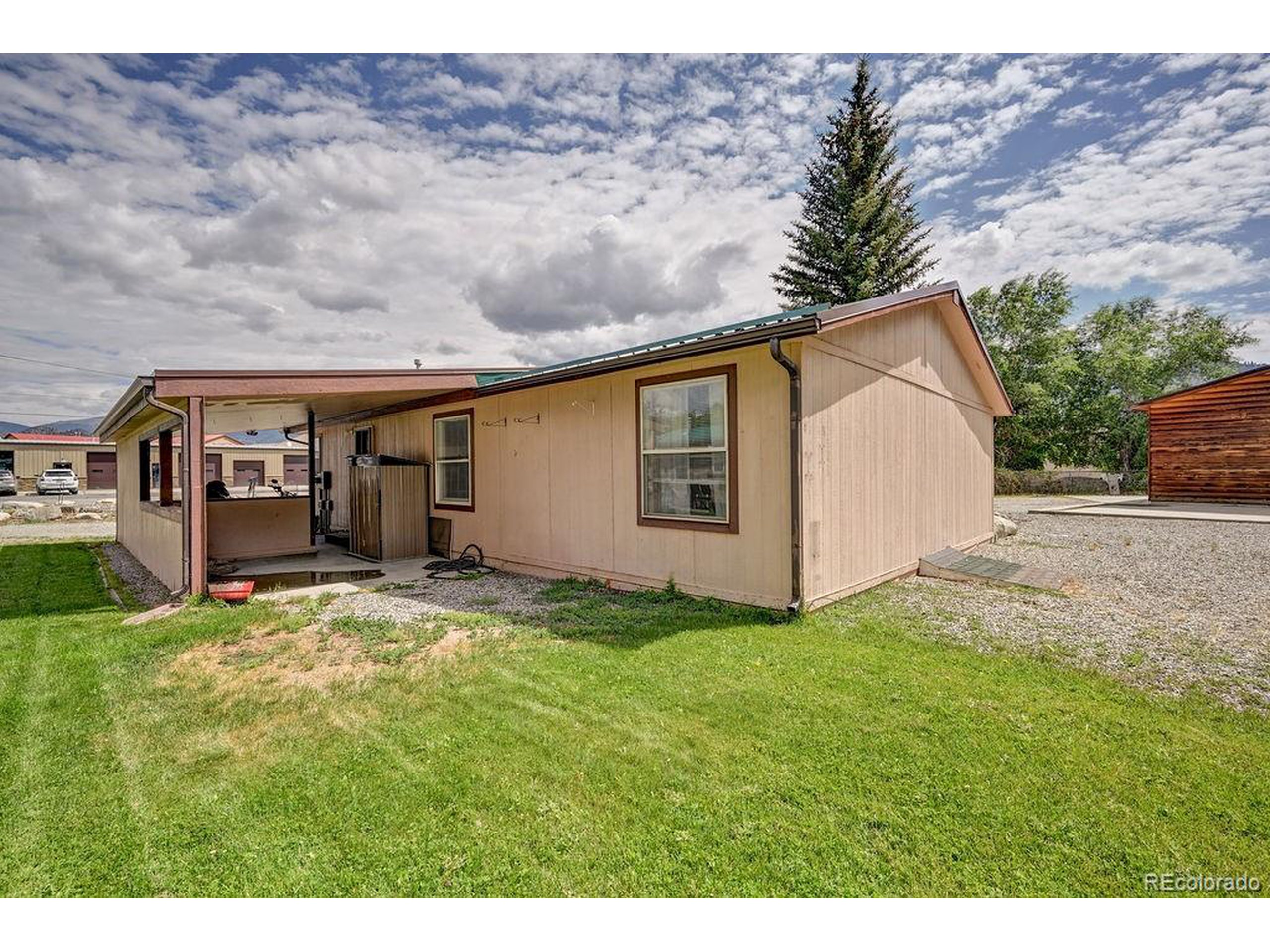 121 Brookdale Avenue Buena Vista, CO 81211 - Photo 18 of 50 a backyard of a house with table and chairs