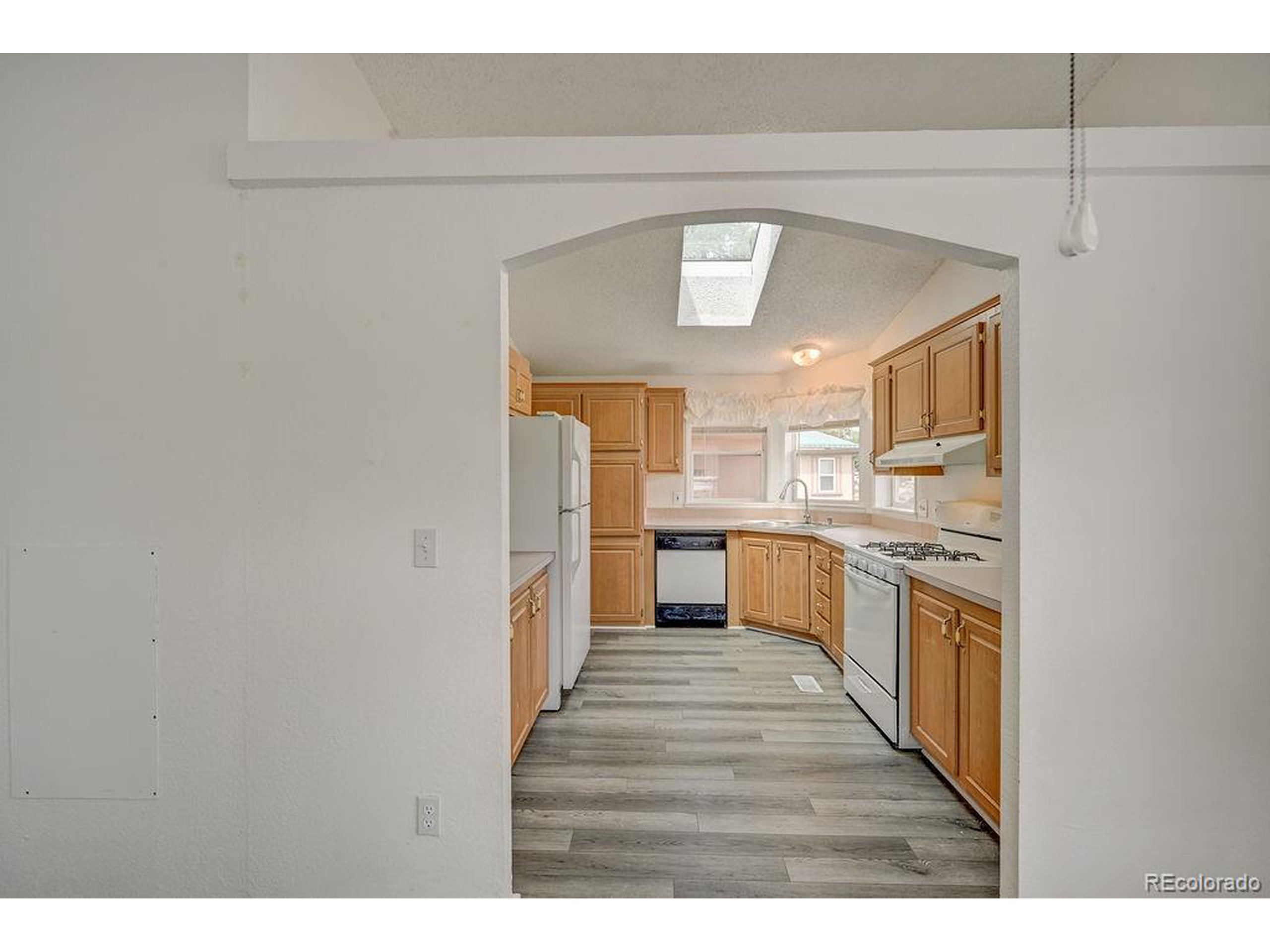 121 Brookdale Avenue Buena Vista, CO 81211 - Photo 20 of 50 a kitchen with stainless steel appliances granite countertop a sink and cabinets
