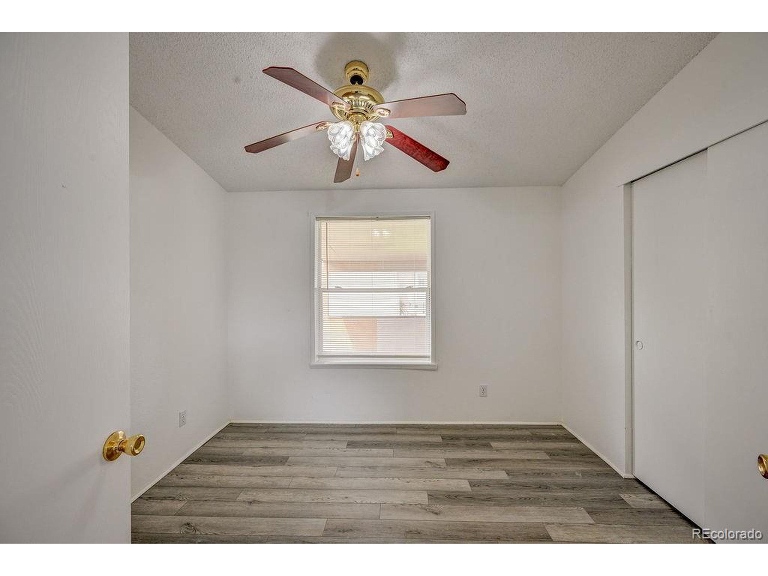 121 Brookdale Avenue Buena Vista, CO 81211 - Photo 26 of 50 a view of empty room with wooden floor