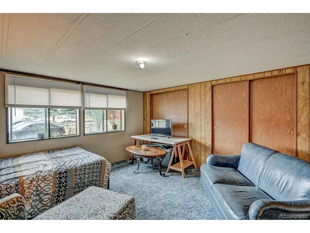 a bedroom with furniture and a window
