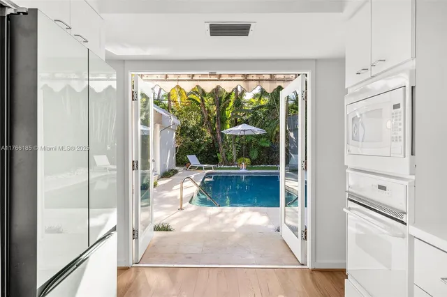 a bedroom with a bed and a lamp next to a window