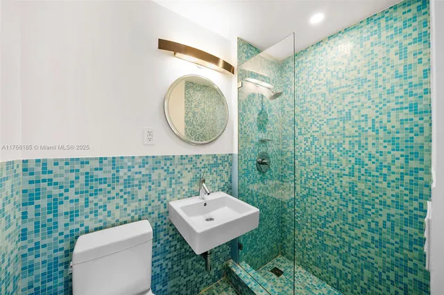 a spacious bedroom with a bed and a couch