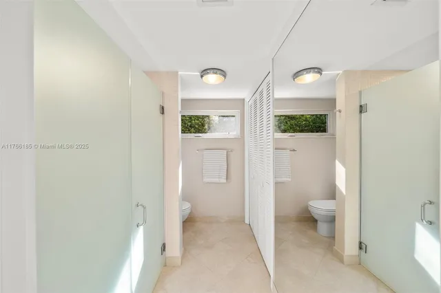 a lobby with furniture and a potted plant