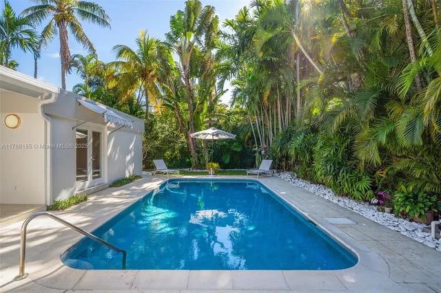 a view of a swimming pool with a patio