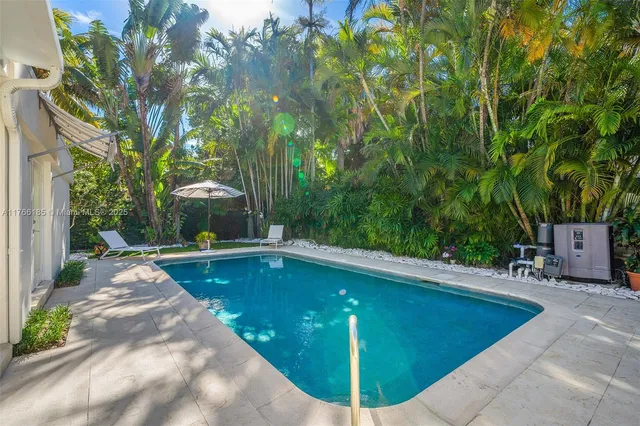 a view of a swimming pool with a patio