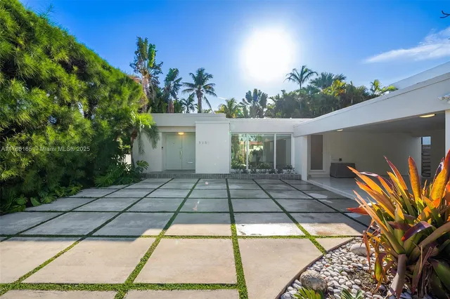 a view of a backyard of the house