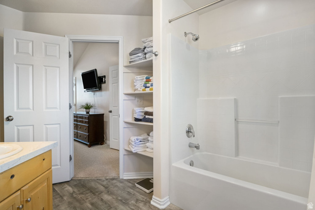 3598 North Huntsman Path, Unit 502 Eden, UT 84310 - Photo 13 of 43 Full bath featuring vanity, dark wood finished floors, and shower / tub combination