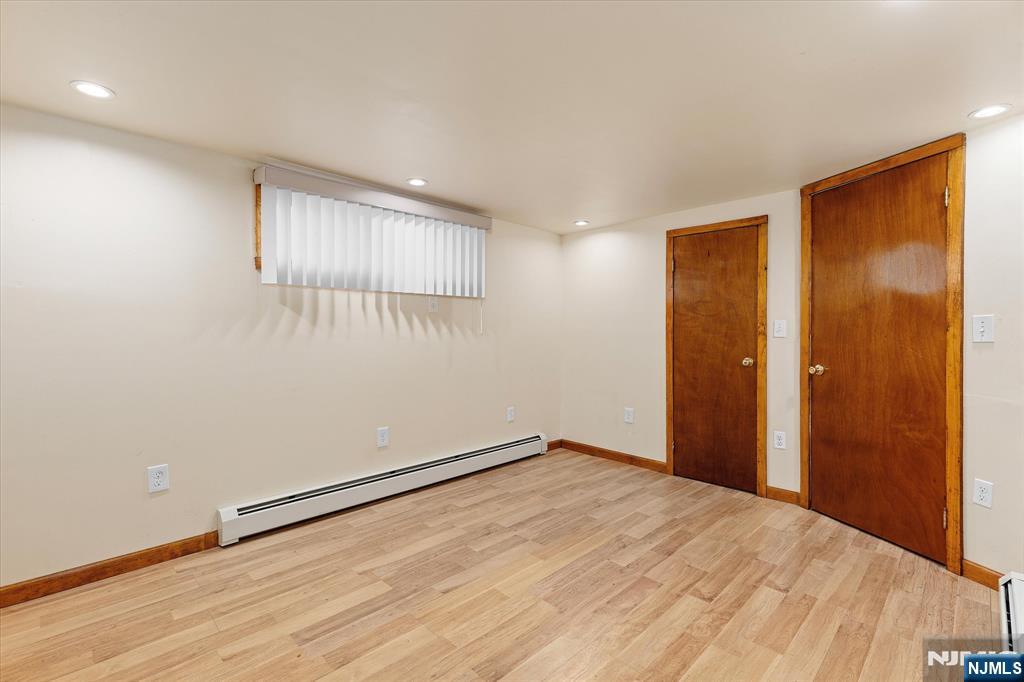 62 Johnson Avenue Wallington, NJ 07057 - Photo 23 of 25 a view of empty room with wooden floor