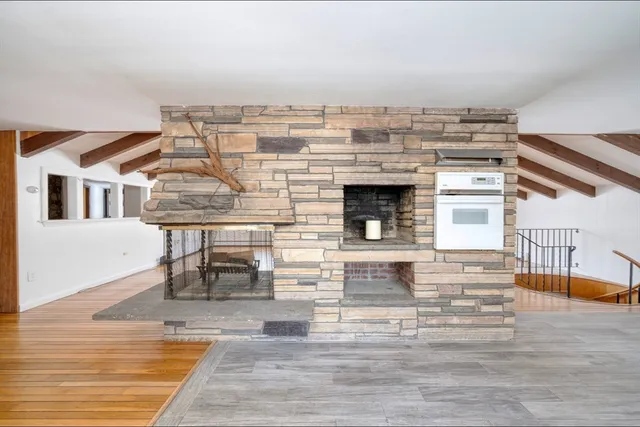 a view of building with wooden floor and seating space