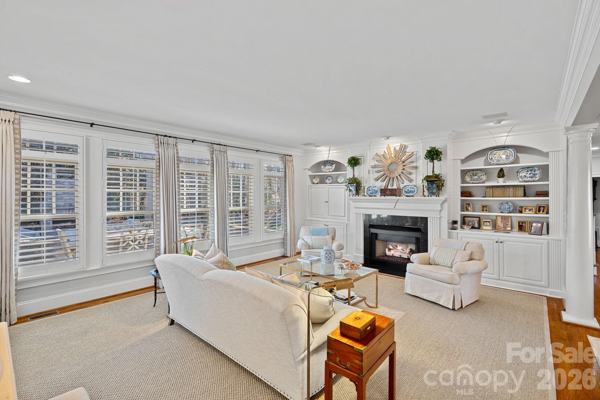 19016 Wildcat Trail Davidson, NC 28036 - Photo 11 of 48 a living room with furniture and a fireplace