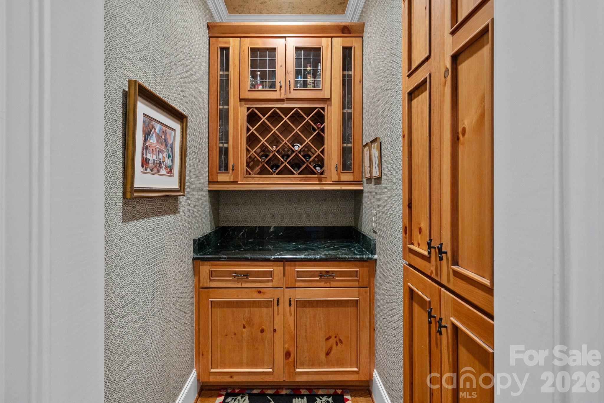19016 Wildcat Trail Davidson, NC 28036 - Photo 14 of 48 a kitchen with granite countertop cabinets and window
