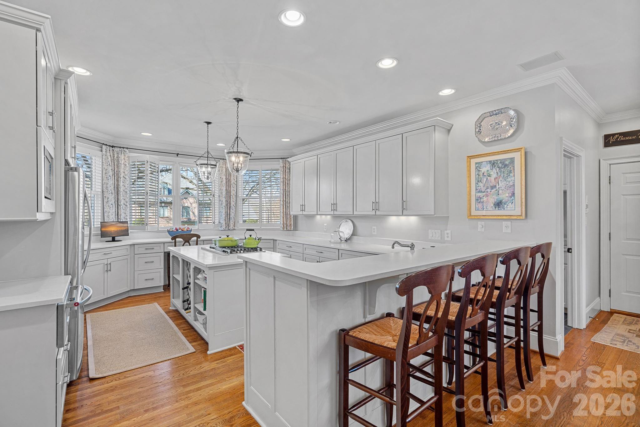 19016 Wildcat Trail Davidson, NC 28036 - Photo 15 of 48 a kitchen with a table and chairs in it