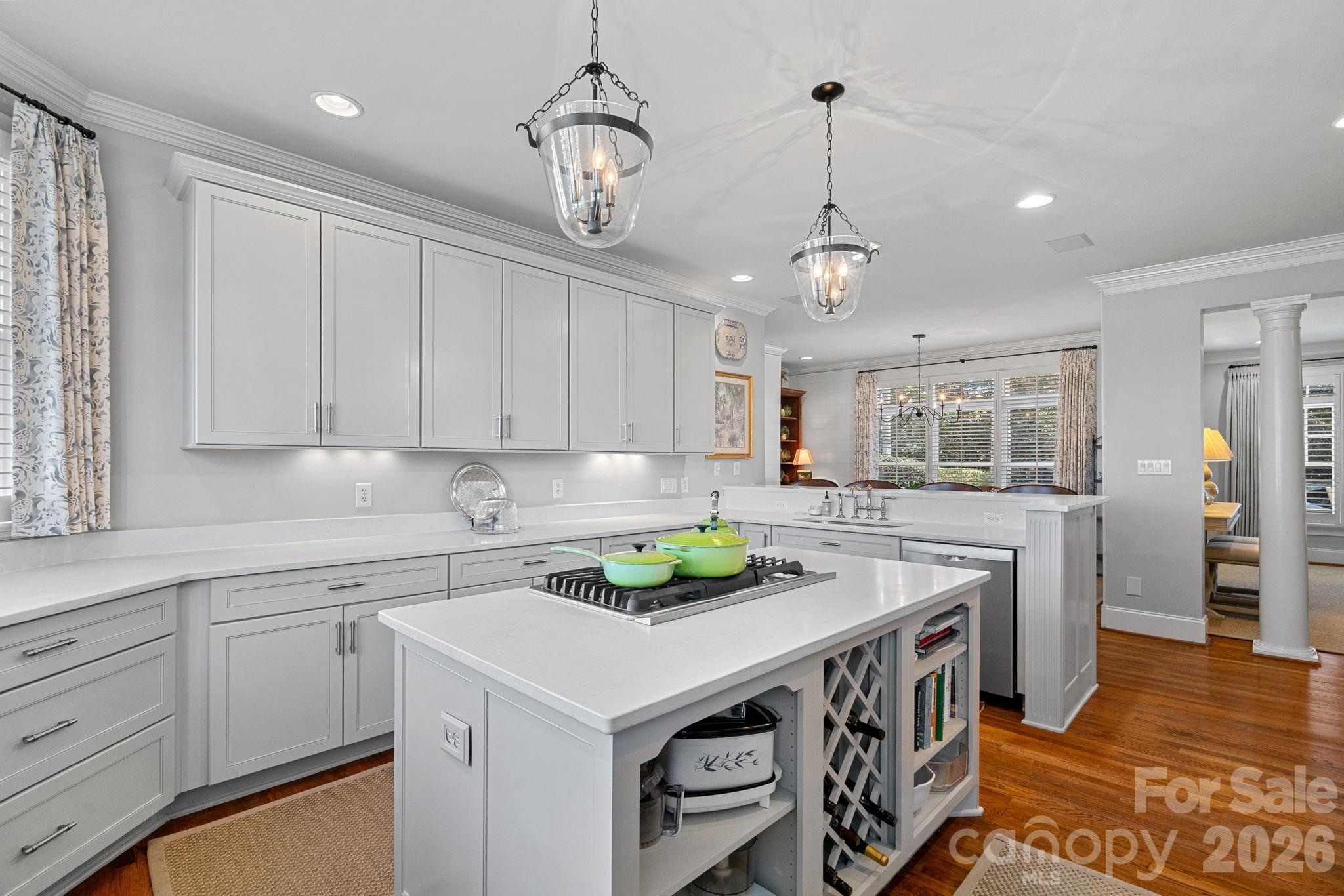 19016 Wildcat Trail Davidson, NC 28036 - Photo 17 of 48 a kitchen that has a sink a stove and a table