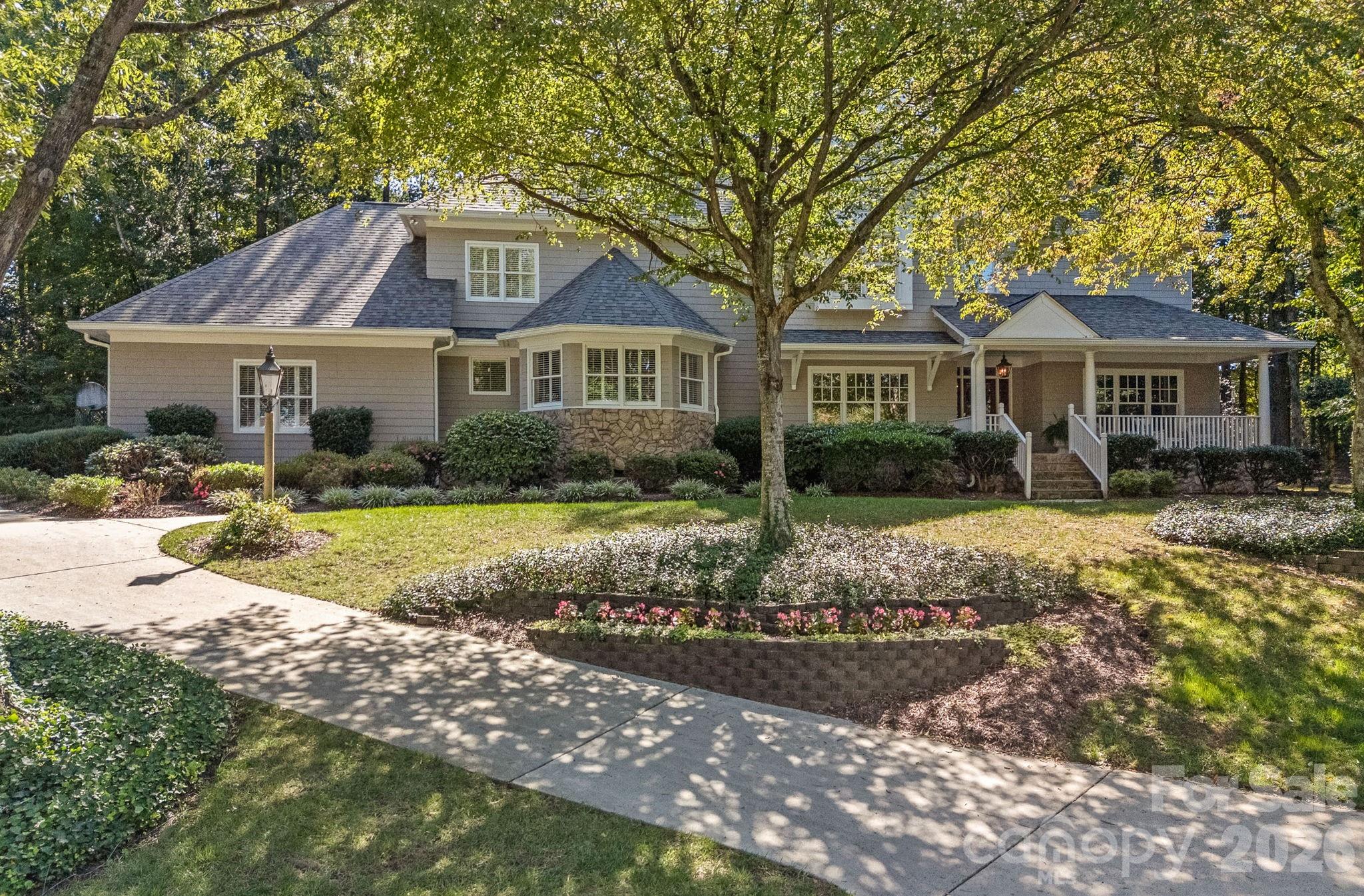 19016 Wildcat Trail Davidson, NC 28036 - Photo 2 of 48 a front view of a house with a yard