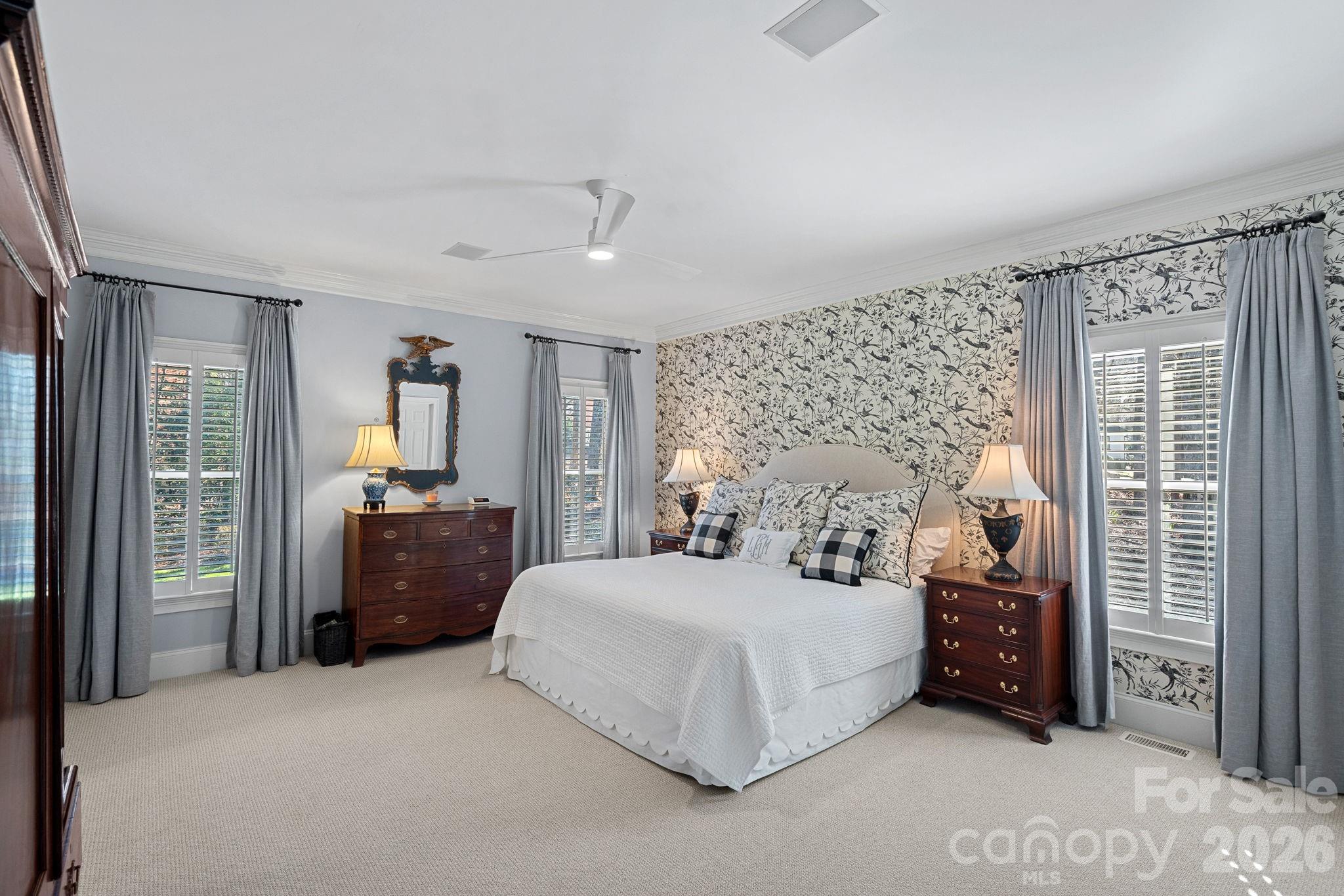 19016 Wildcat Trail Davidson, NC 28036 - Photo 22 of 48 a bedroom with a bed a dresser and a large mirror