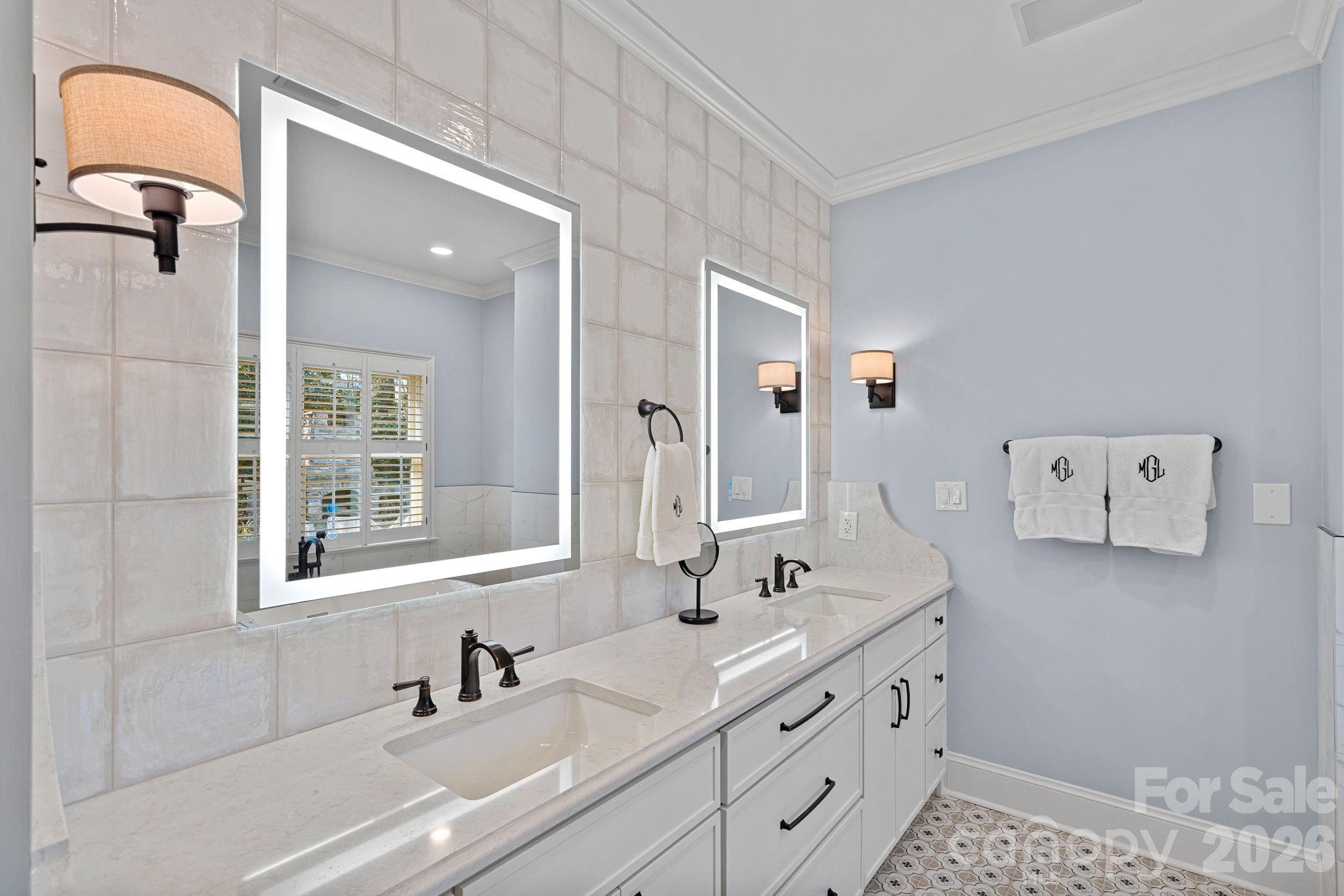 19016 Wildcat Trail Davidson, NC 28036 - Photo 23 of 48 a bathroom with a double vanity sink and mirror