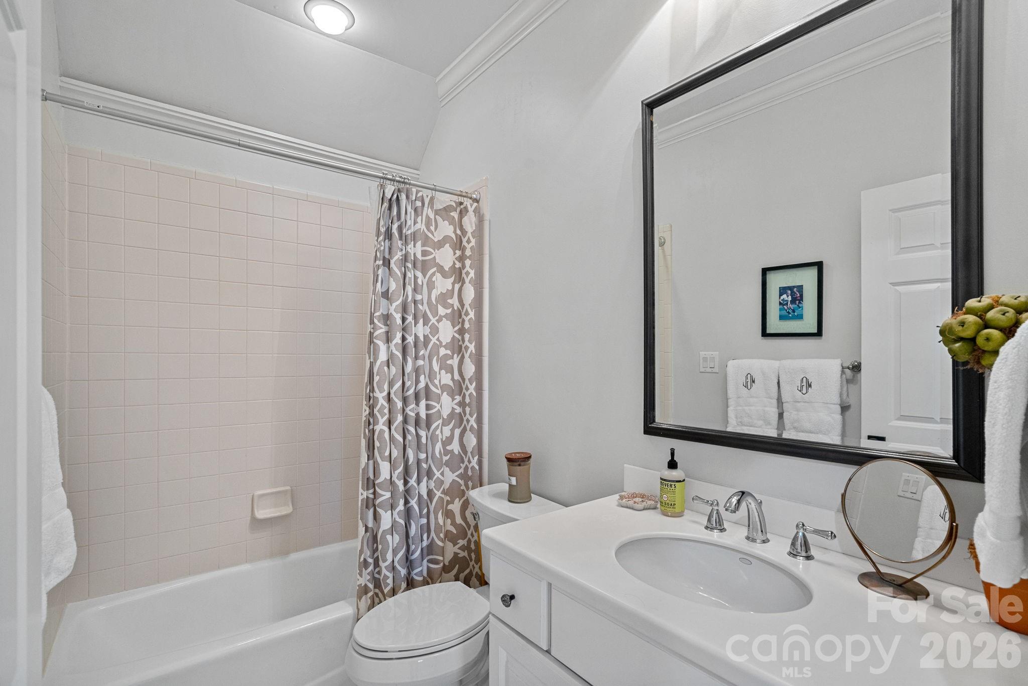 19016 Wildcat Trail Davidson, NC 28036 - Photo 28 of 48 a bathroom with a granite countertop sink toilet and shower