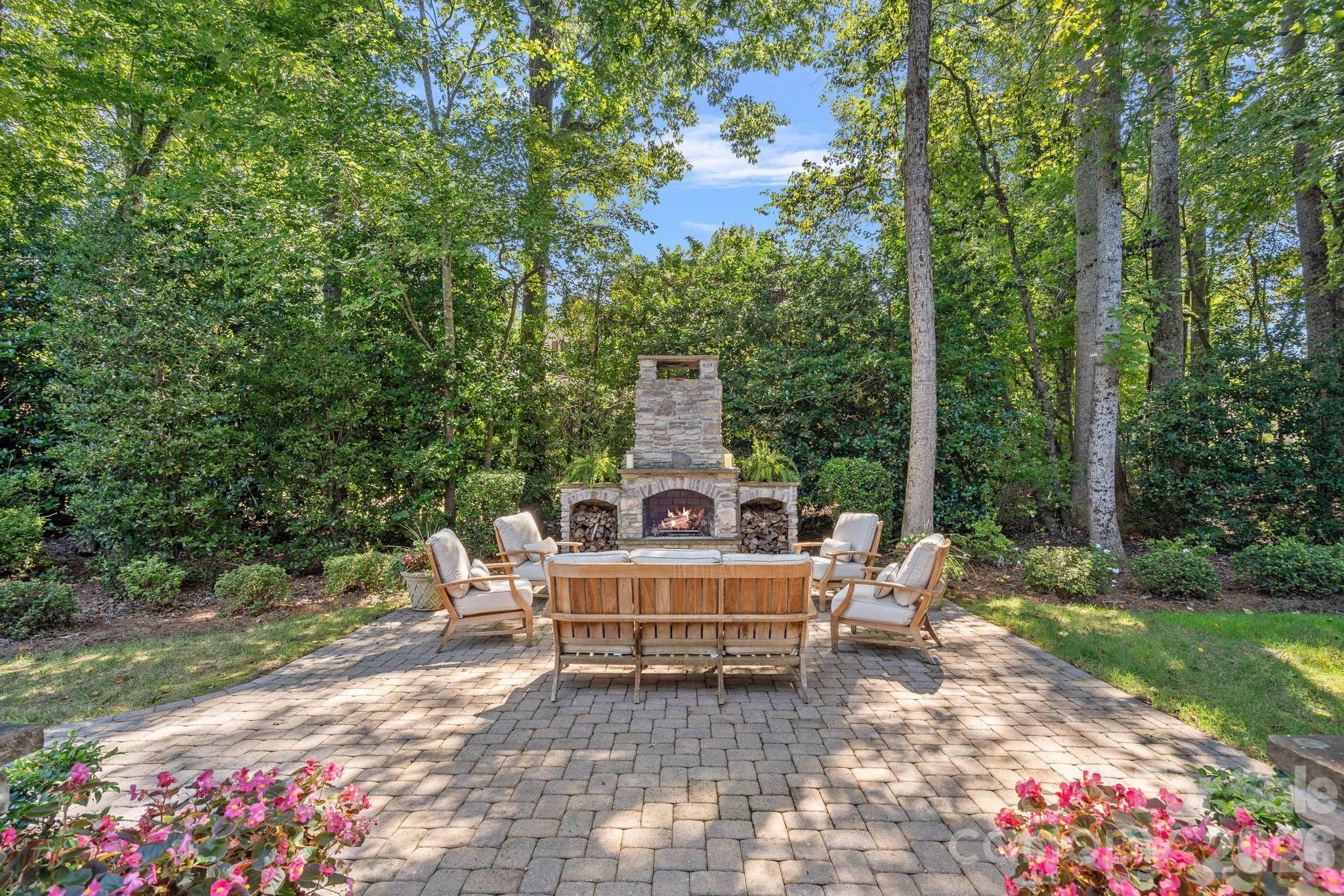 19016 Wildcat Trail Davidson, NC 28036 - Photo 36 of 48 a view of a chairs and table in the backyard with garden