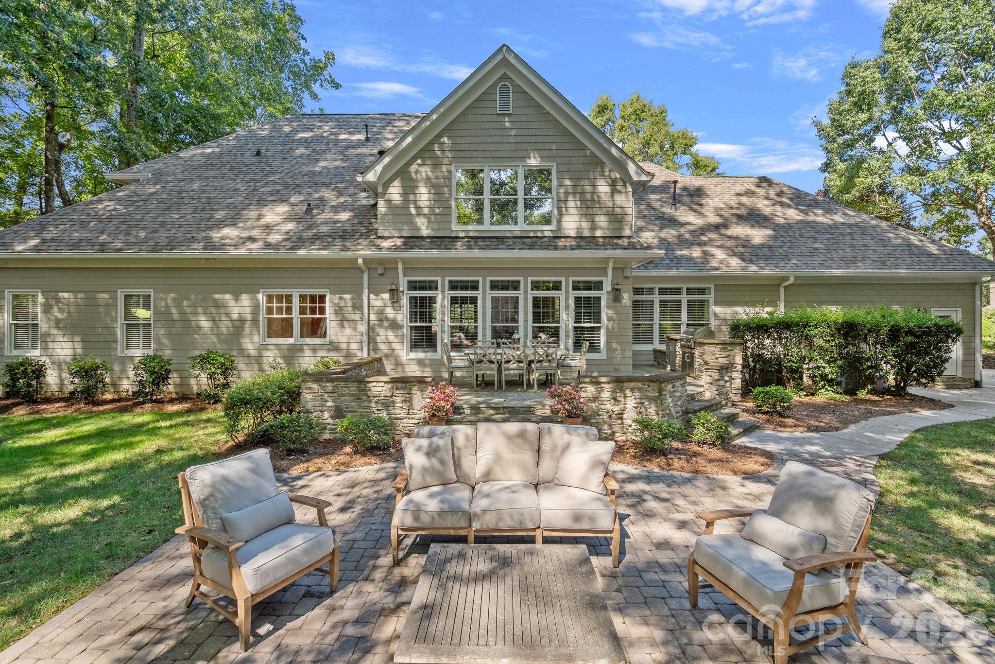 19016 Wildcat Trail Davidson, NC 28036 - Photo 38 of 48 a view of a house with a yard chairs and table in patio