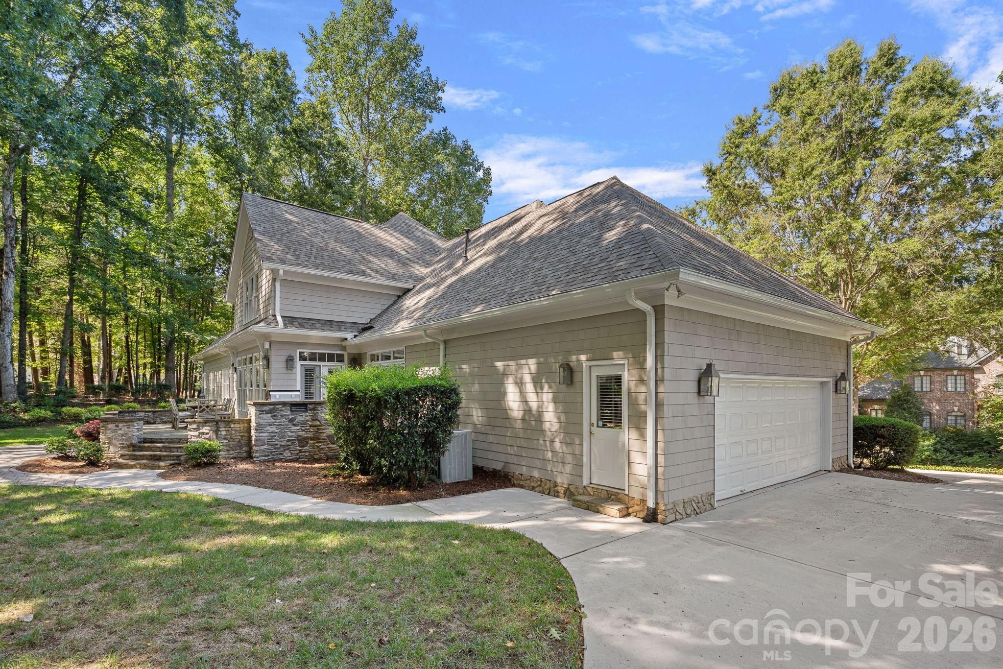 19016 Wildcat Trail Davidson, NC 28036 - Photo 41 of 48 a front view of a house with a garden