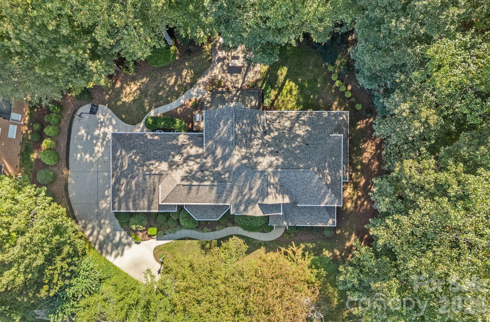 19016 Wildcat Trail Davidson, NC 28036 - Photo 43 of 48 an aerial view of a house with swimming pool and garden