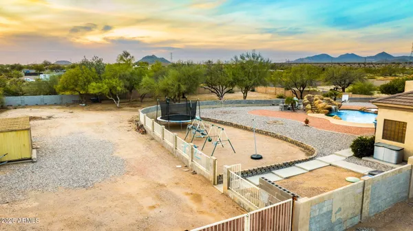 a view of a swimming pool with a patio