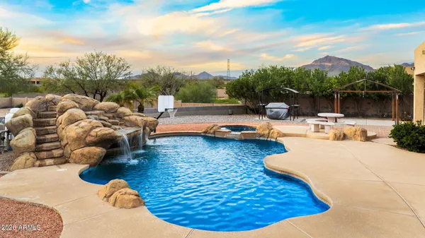 a view of a swimming pool with lounge chairs