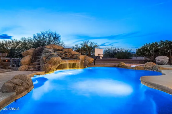 a view of swimming pool with lounge chair
