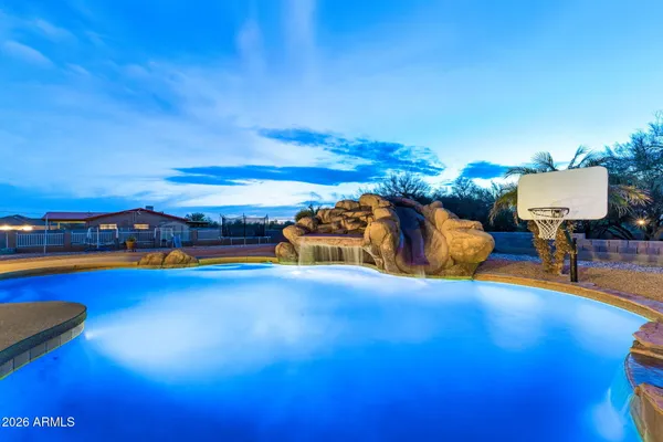 a view of swimming pool with furniture
