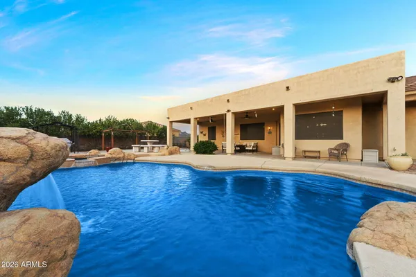 a view of swimming pool with seating space