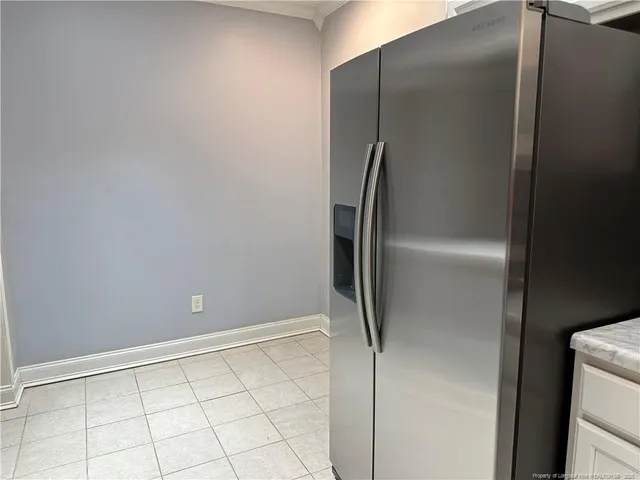 a view of a refrigerator in kitchen