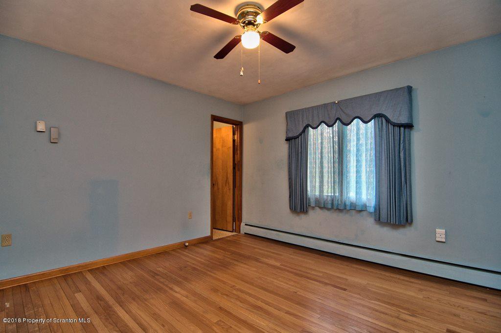 1073 Mt Cobb Road Lake Ariel, PA 18436 - Photo 12 of 22 wooden floor in an empty room with a window