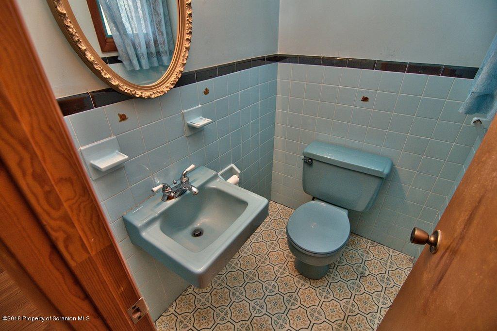 1073 Mt Cobb Road Lake Ariel, PA 18436 - Photo 13 of 22 a bathroom with a toilet and a sink