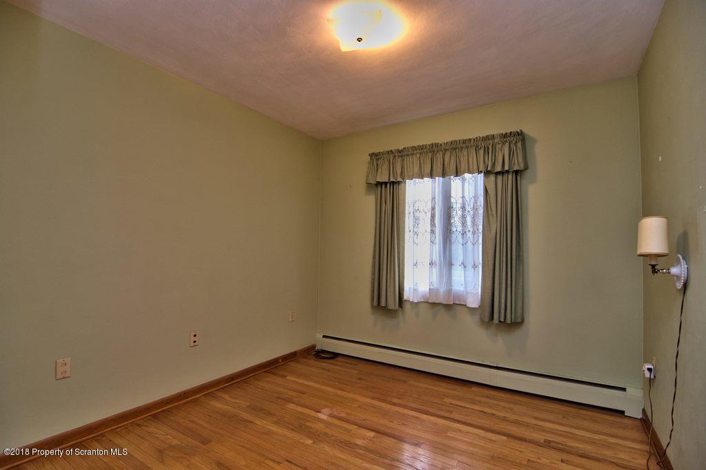 1073 Mt Cobb Road Lake Ariel, PA 18436 - Photo 15 of 22 a view of a room with wooden floor and windows