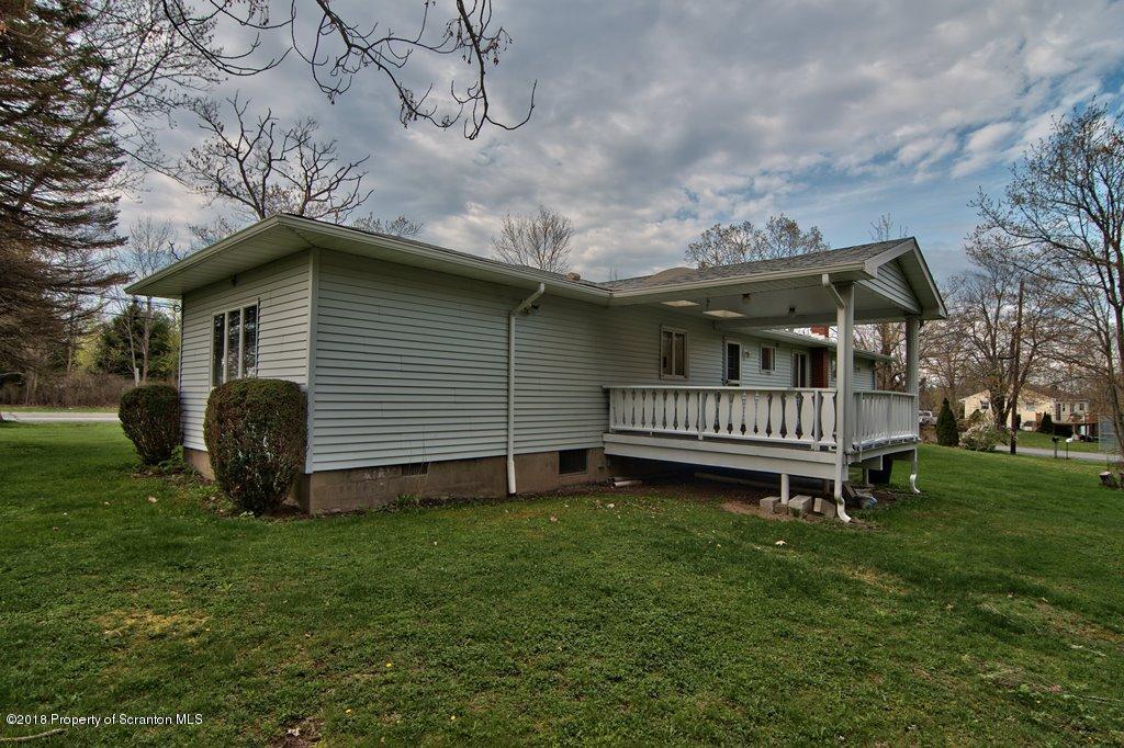 1073 Mt Cobb Road Lake Ariel, PA 18436 - Photo 20 of 22 a backyard of a house with a garden and deck