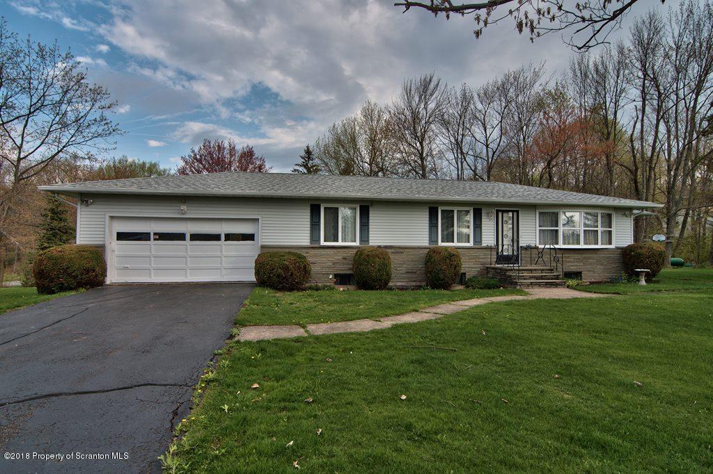 1073 Mt Cobb Road Lake Ariel, PA 18436 - Photo 2 of 22 a front view of a house with garden