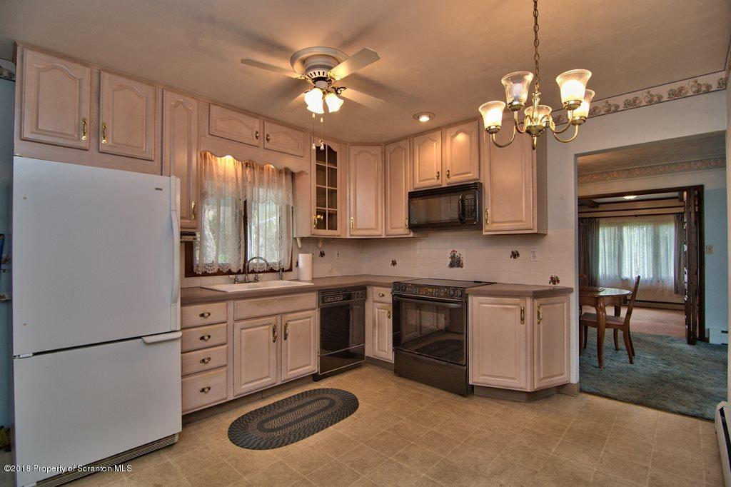 1073 Mt Cobb Road Lake Ariel, PA 18436 - Photo 6 of 22 a kitchen with kitchen island granite countertop stainless steel appliances lots of counter top space