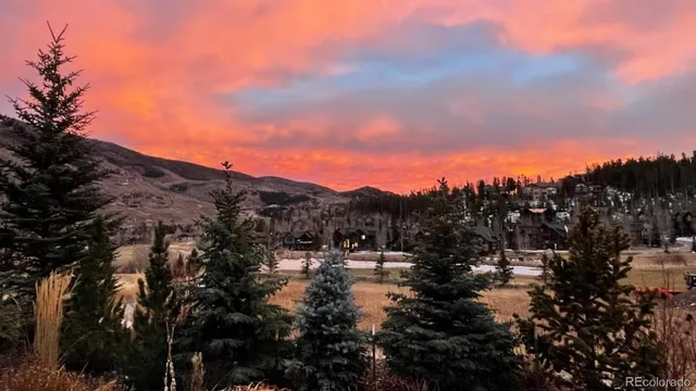 a view of a town with mountains in the background