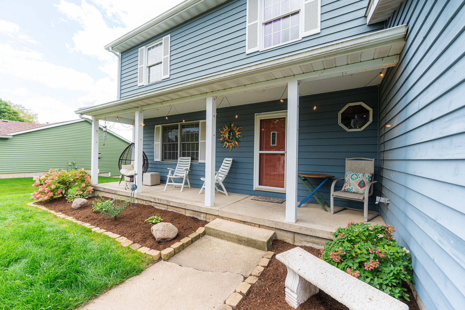 1020 Michael Street Sycamore, IL 60178 - Photo 2 of 3 a view of a house with backyard porch and sitting area