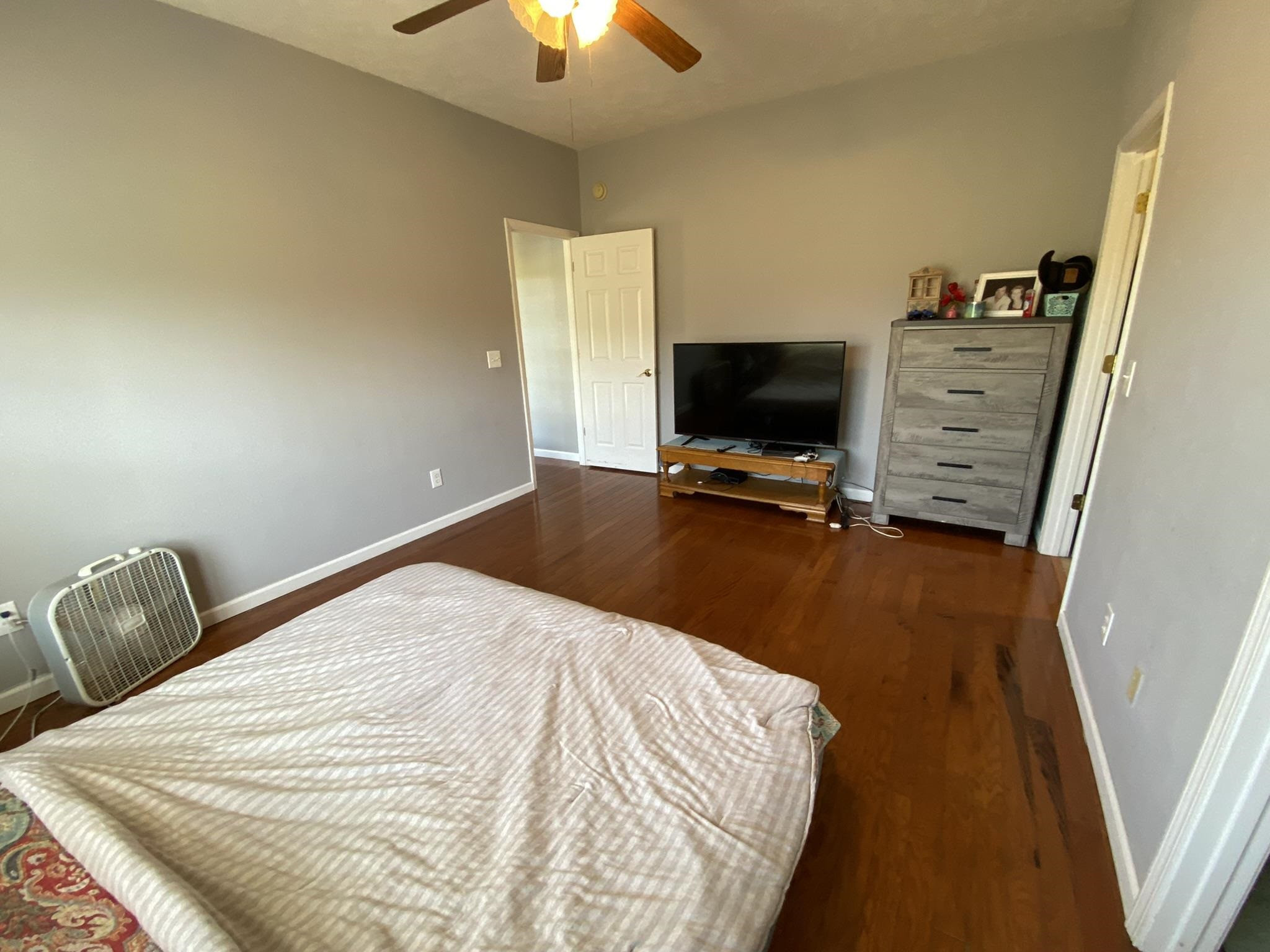124 Milan Road Finger, TN 38334 - Photo 14 of 32 a bedroom with a bed and a flat tv screen on dresser