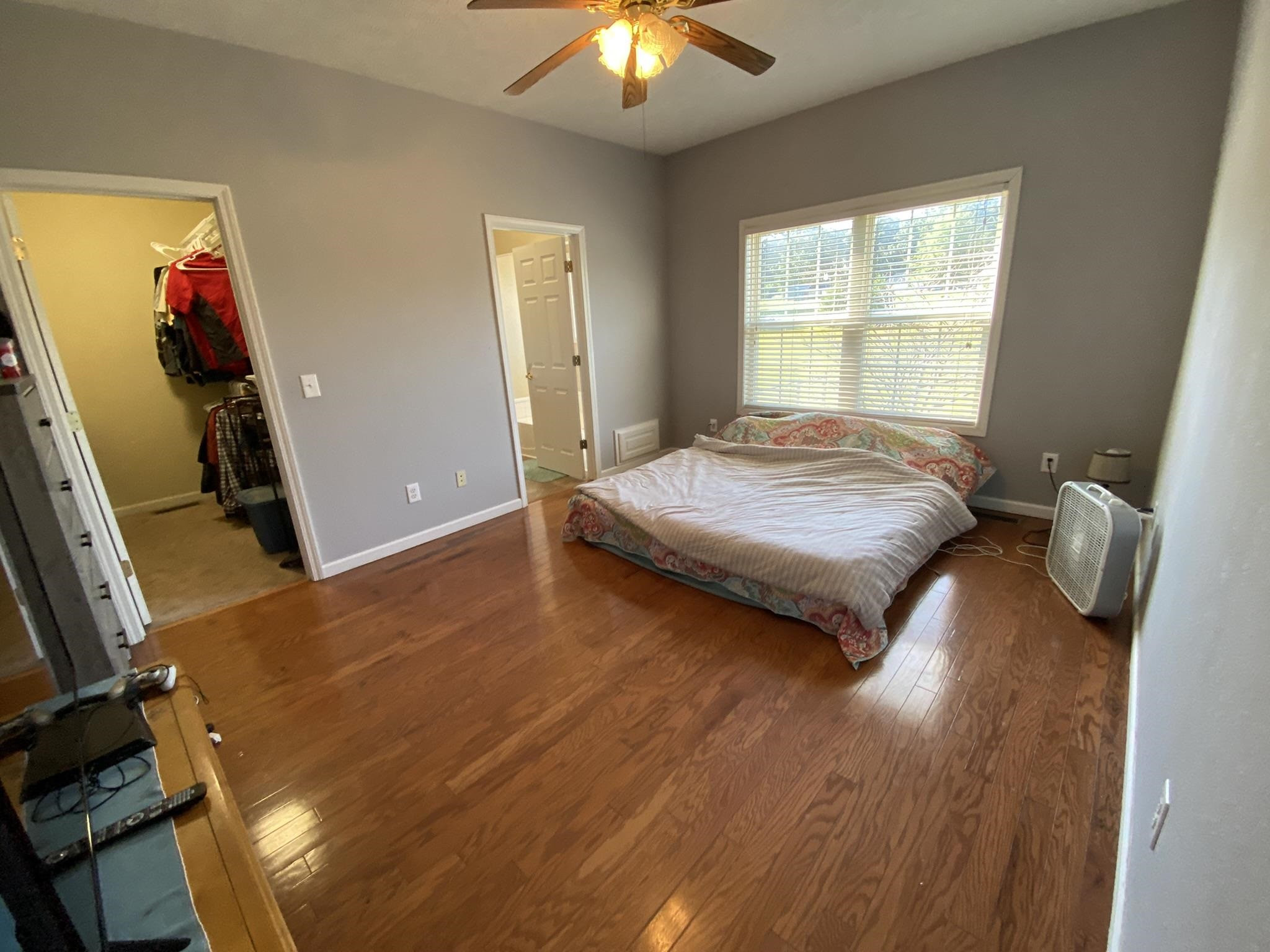 124 Milan Road Finger, TN 38334 - Photo 10 of 32 a bedroom with a bed and a chandelier