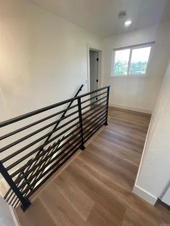 a view of a room with wooden stairs