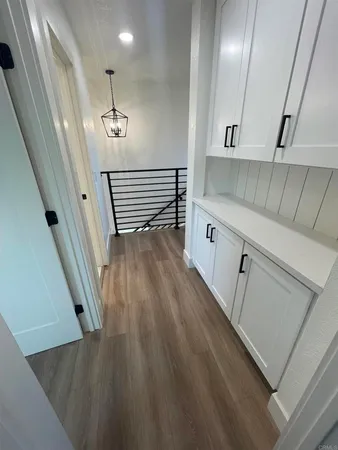 a hallway with cabinets