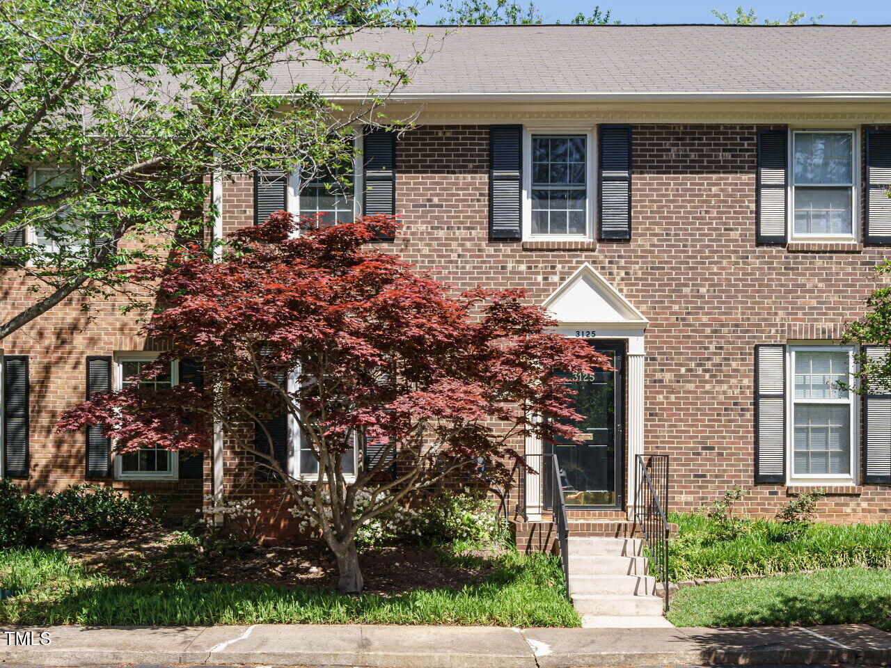 front view of house with a small yard